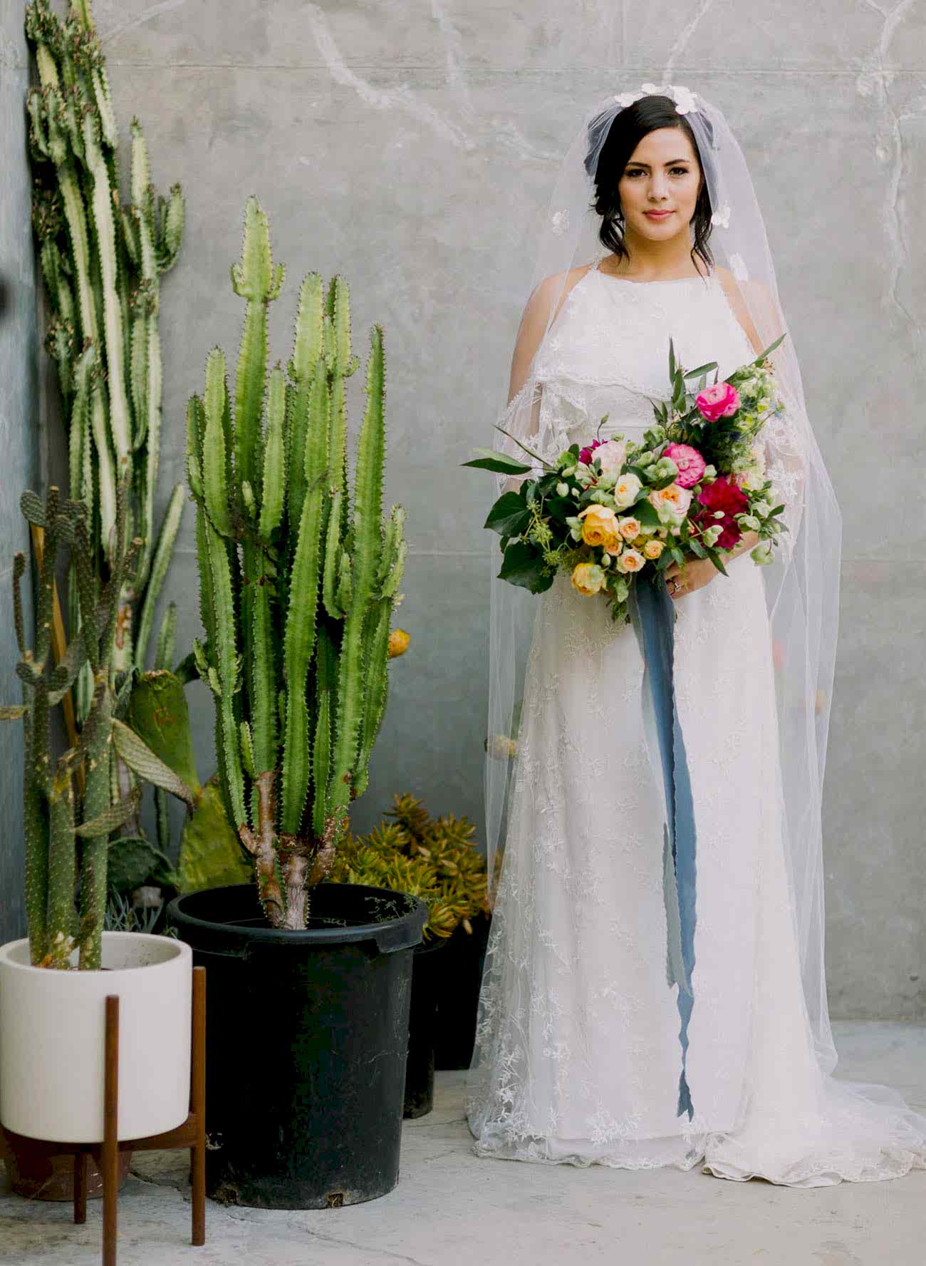 colorful yellow and pink hand-tied bridal bouquet with long ribbon