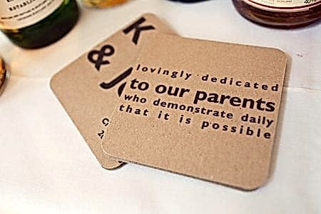 Cardboard coaster with words dedicating things to parents