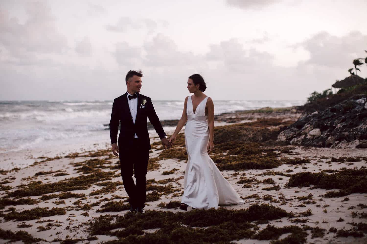 couple having a formal beach wedding