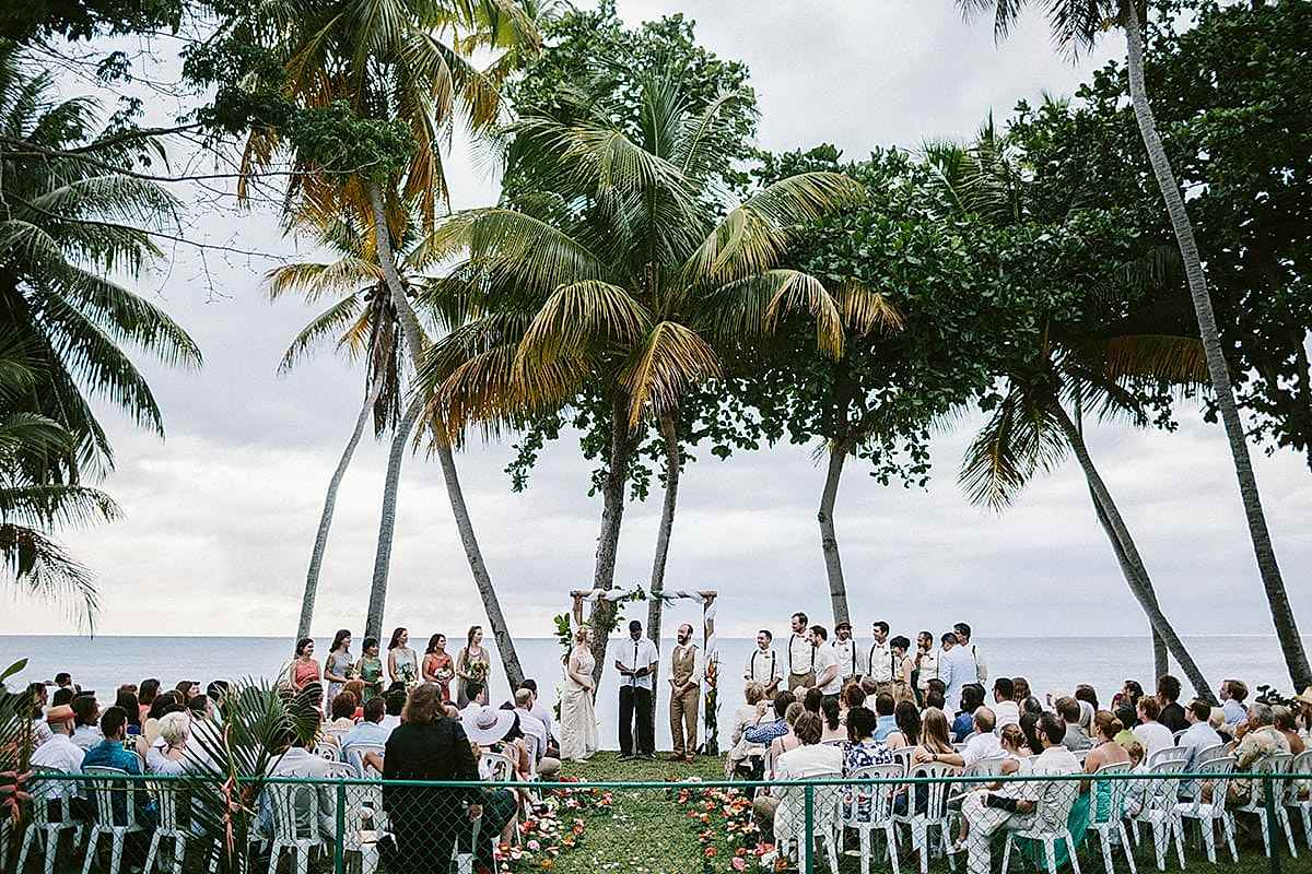 A wedding ceremony taking place at the shore