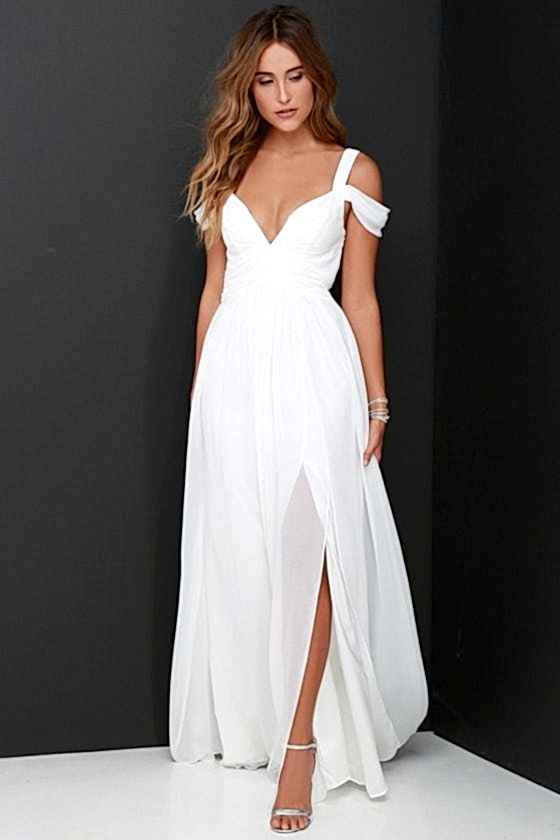A woman wears a white dress