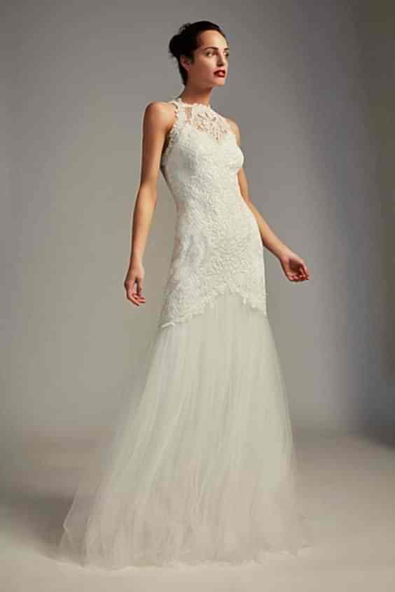 A woman wears a white dress