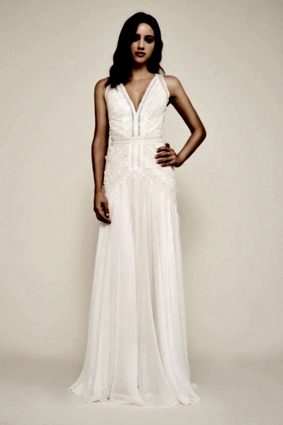 A woman wears a white dress