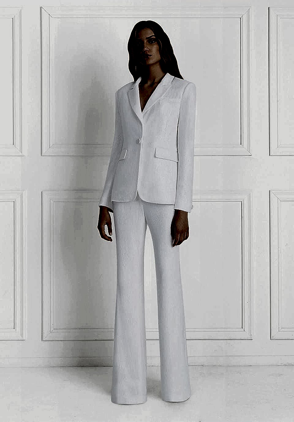 A woman wears a white pantsuit