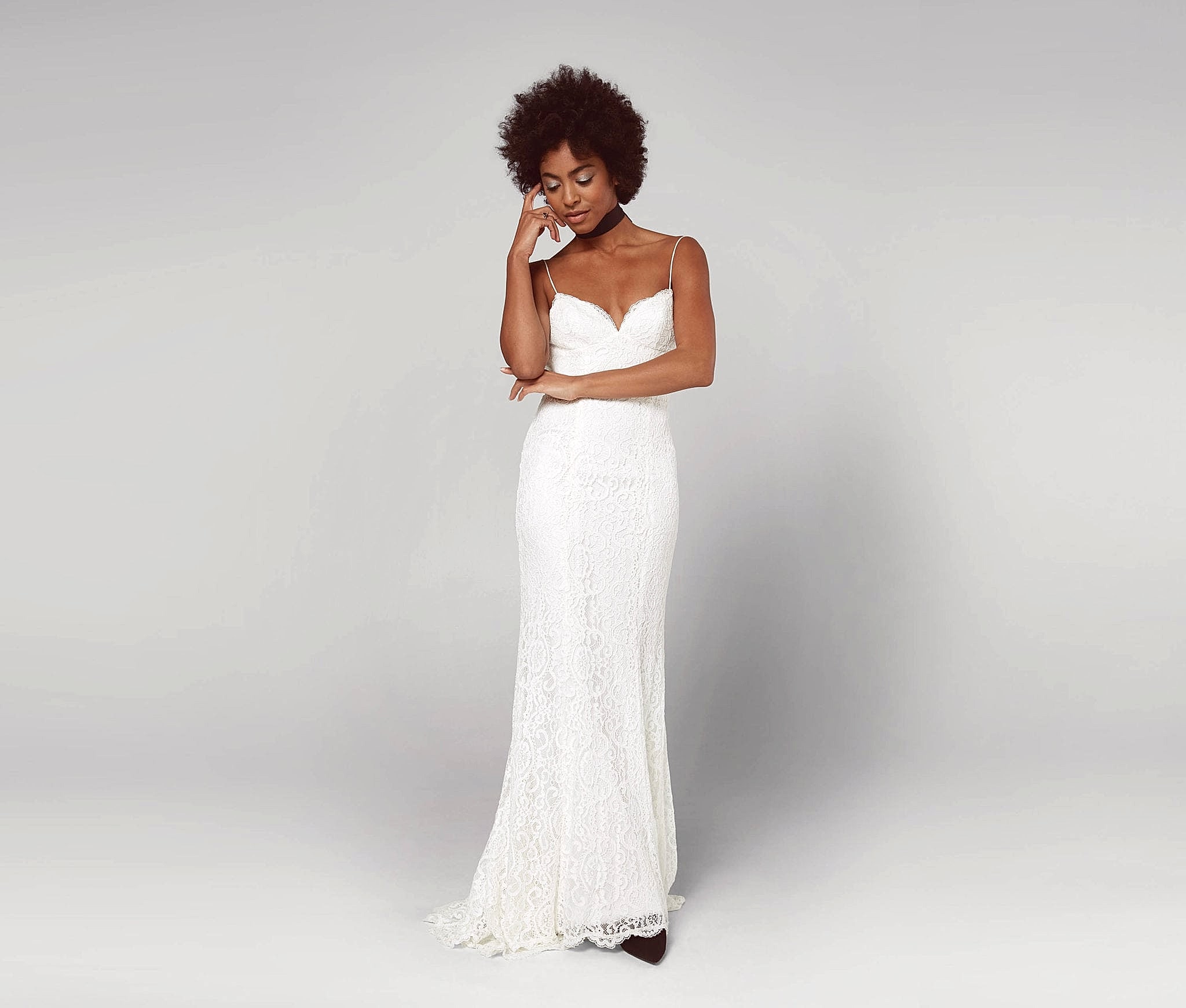 A woman wears a white dress