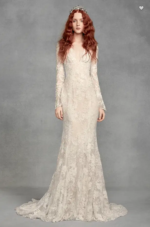 a woman ears an off-white long-sleeve v-neck lace dress