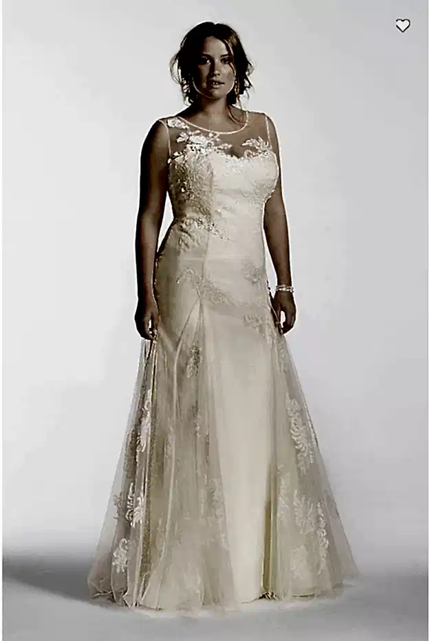 a woman wears an off-white strapless a-line dress with a sleeveless sheer embroidered overlay