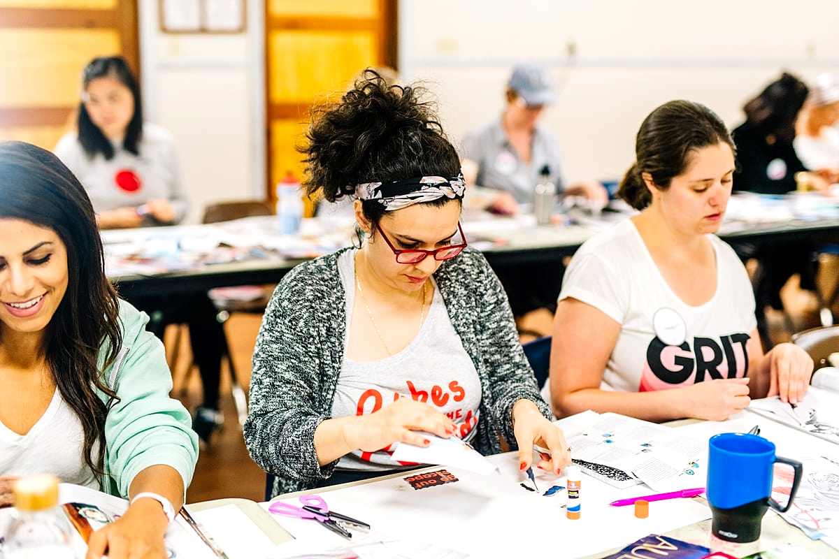 Women vision boarding at the compact summer camp in la Honda, CA