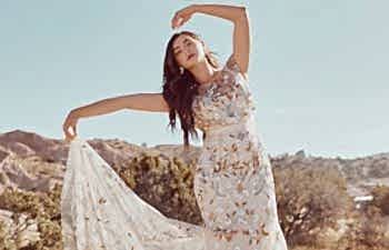 A woman dancing in a BHLDN dress