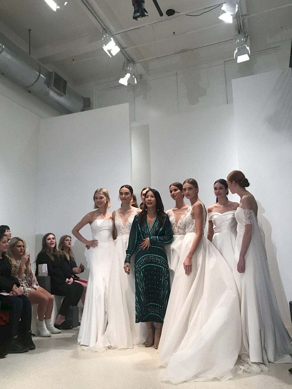 Jenny Yoo on the runway with the models showing her 2019 Fall collection at New York Bridal Fashion Week