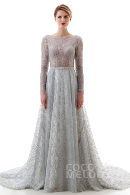 Blonde woman wearing dramatic silver gown