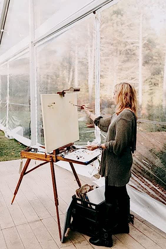 wedding ideas for ceremony art—a professional artist painting a picture during the ceremony