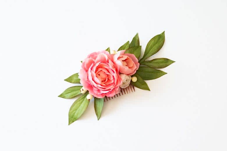 wedding ideas for hair accessories—a hair comb with pink flowers