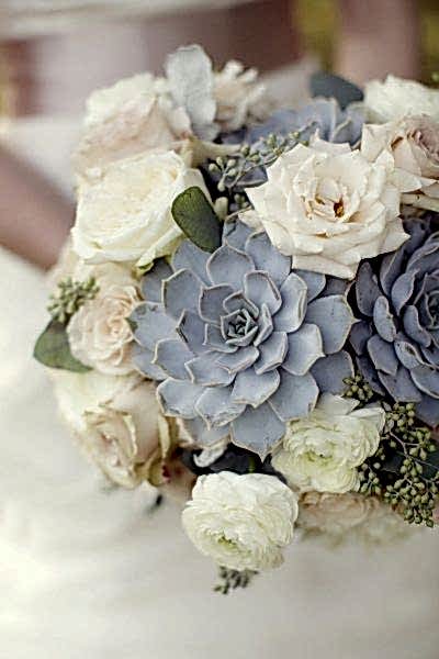 Succulent and rose bouquet closeup in blue-grey, cream, and sage winter wedding colors