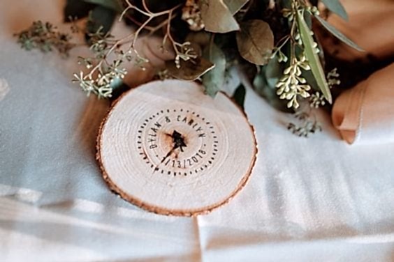 wedding ideas for custom wood coasters—reads "Dylan & Carlyn *1/13/2018*"