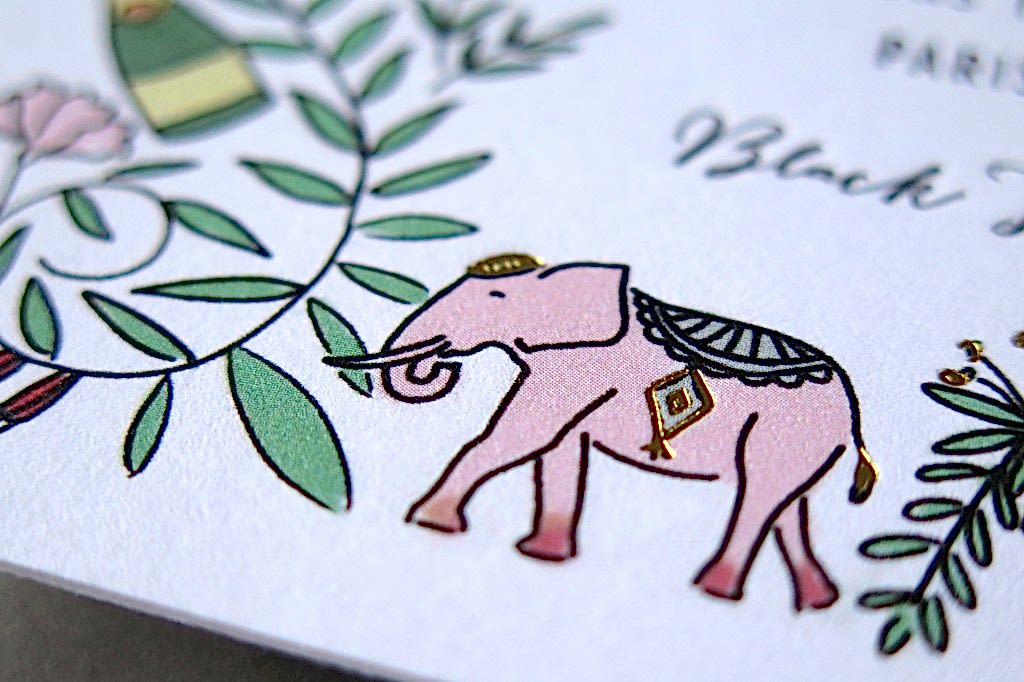 close-up shot of a detail of pink elephant with gold foil on a letterpress invitation by Thomas Printers