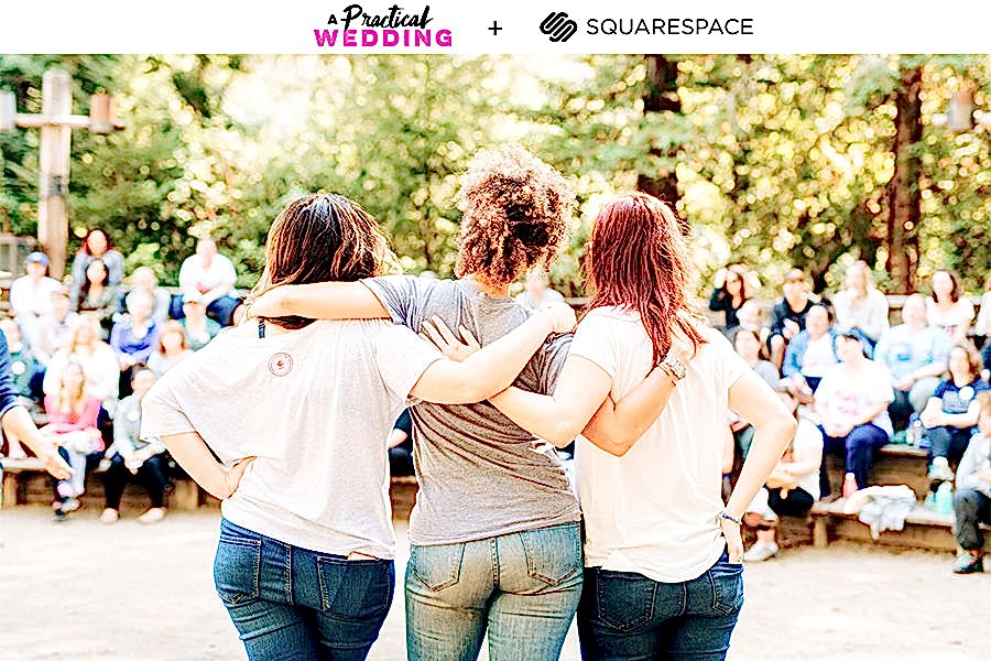 Three women in short sleeve tees and blue jeans stand with their arms around each other, looking out at a group of women gathered under trees sitting on benches. The text A Practical Wedding + Squarespace reads above.