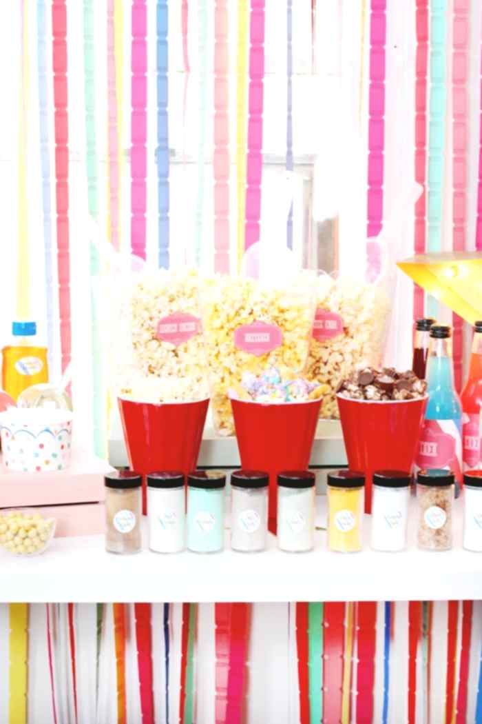 Colorful popcorn bar setup as an engagement party idea