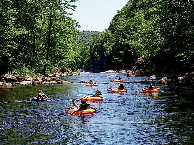 People tubing in river as an engagement party idea