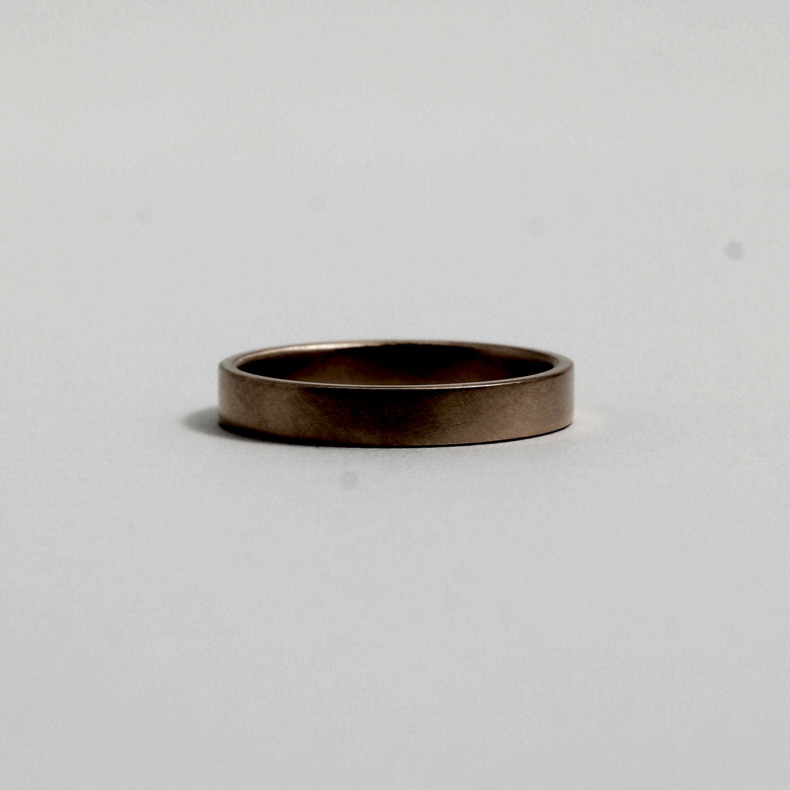 A gold wedding band from Good Gold
