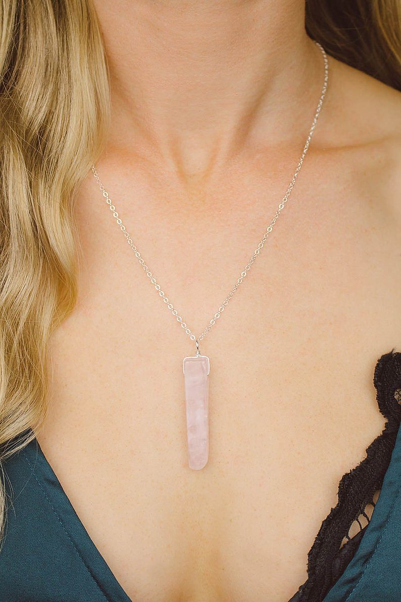 Blonde woman wearing rose quartz necklace for bridal shower favors