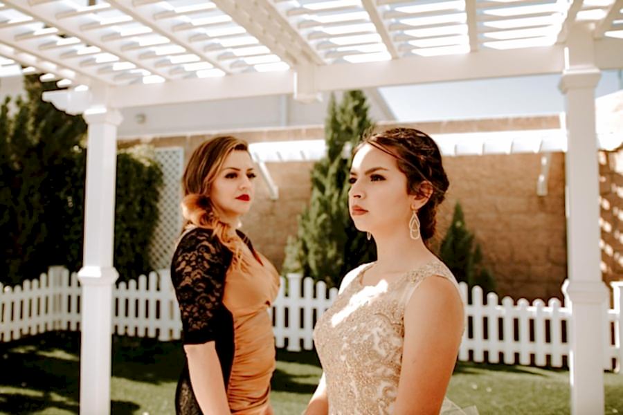 Two women look off in different directions