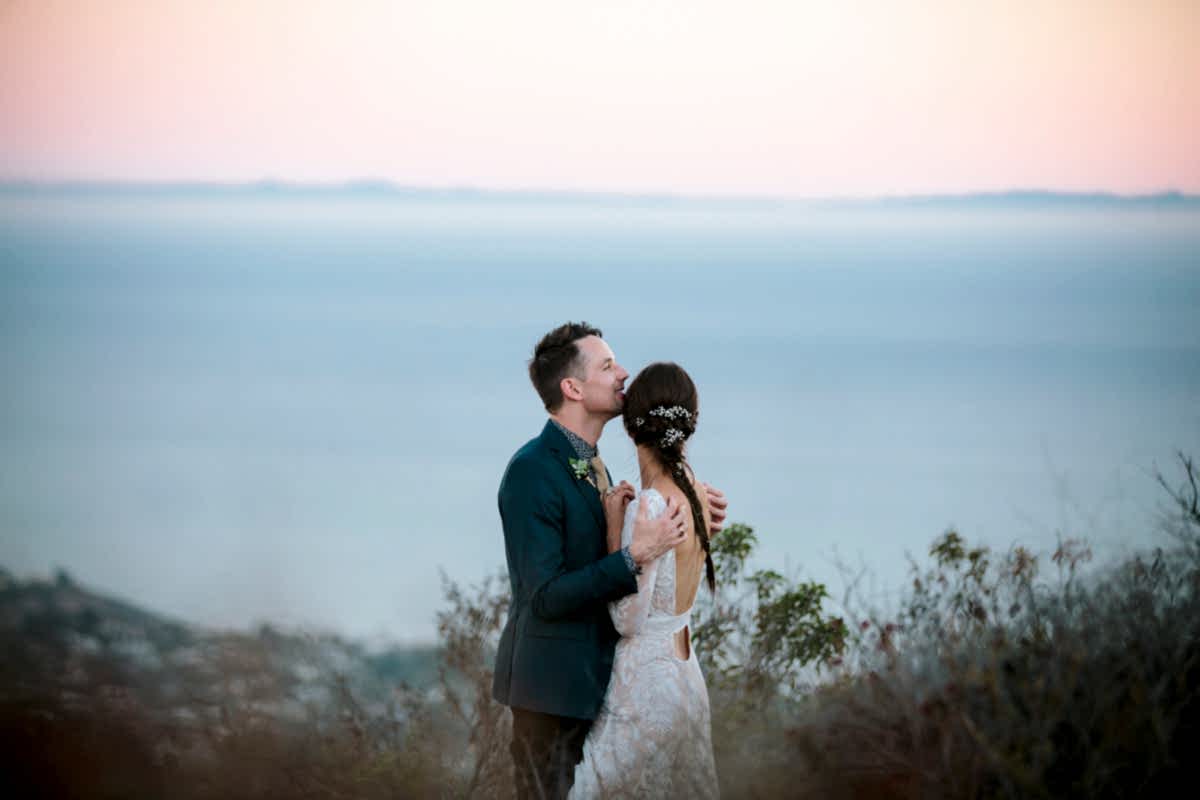 Couple kissing after saying wedding vows