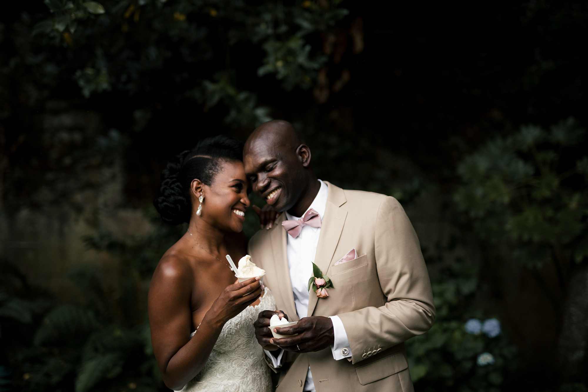 Bride and groom holding ice cream