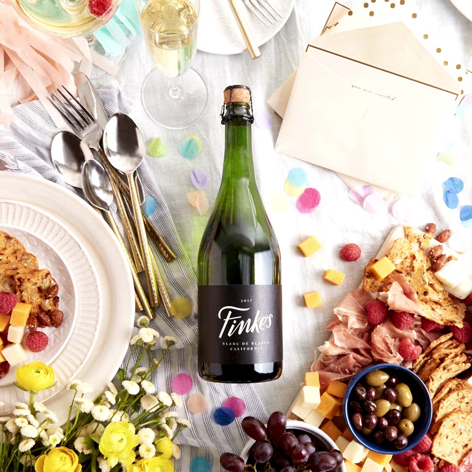 A bottle Winc wine set on a table