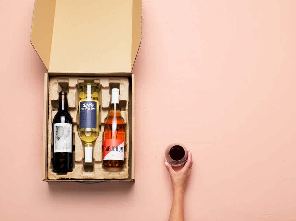 An open mailing package of Winc wine 