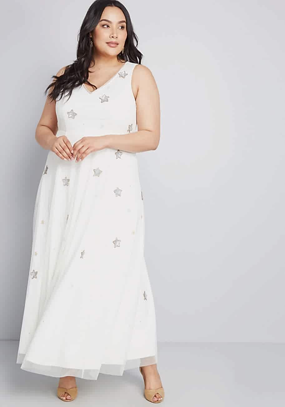 plus size woman wearing a star embellished wedding dress