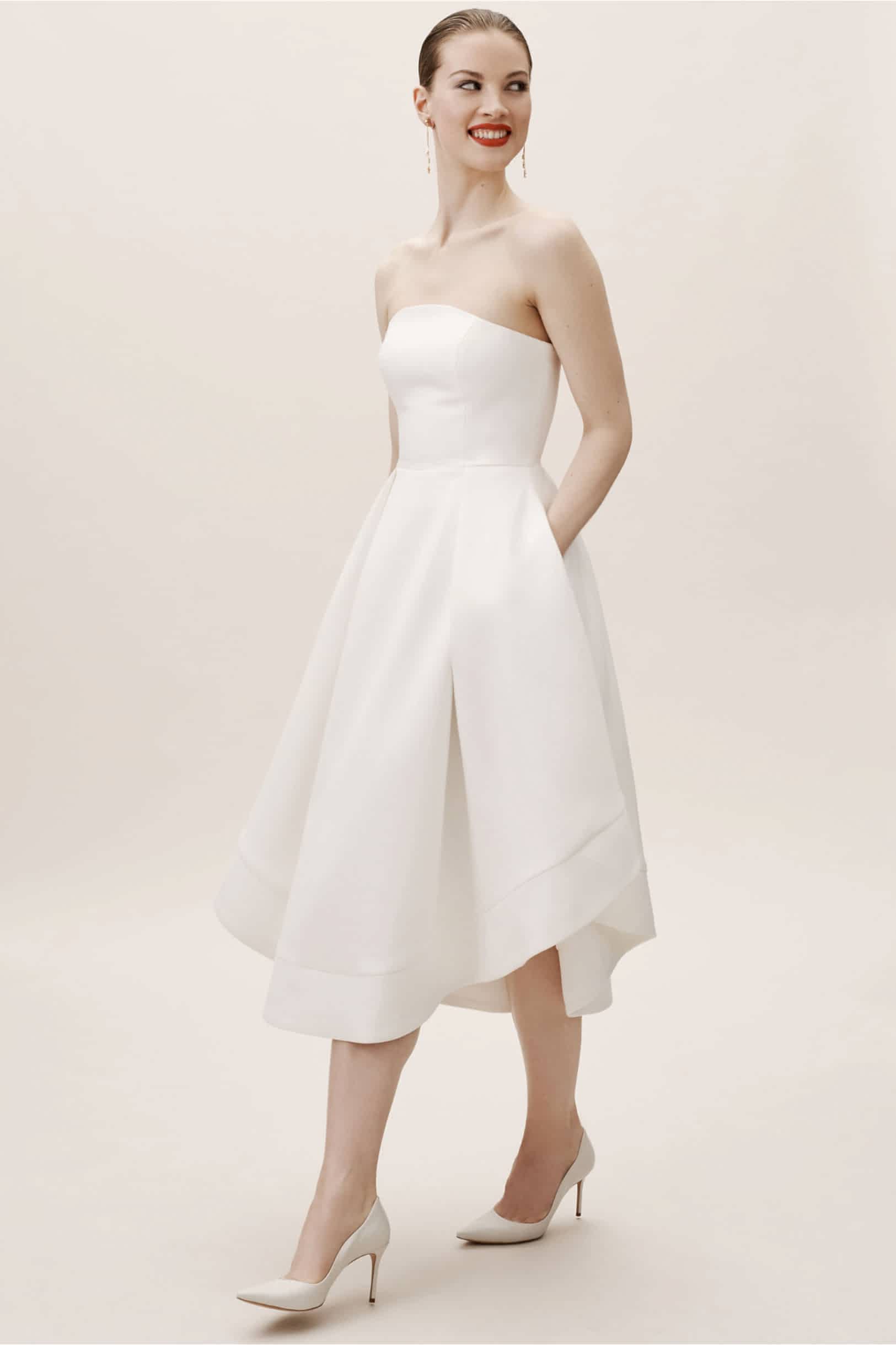 woman wearing a short strapless simple wedding dress