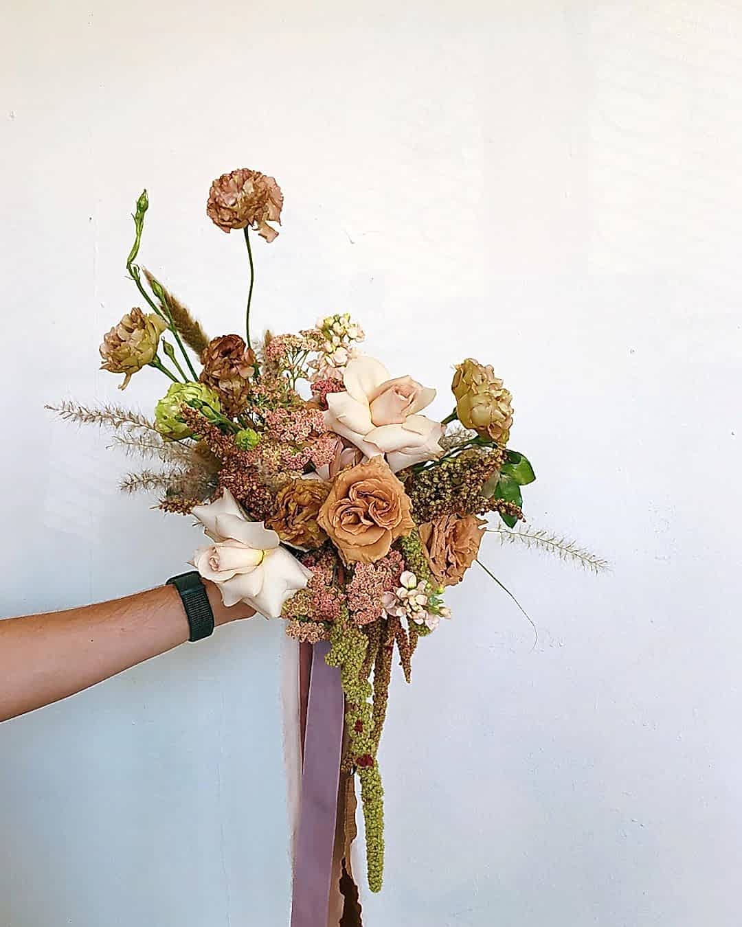 A wedding bouquet with fall colors