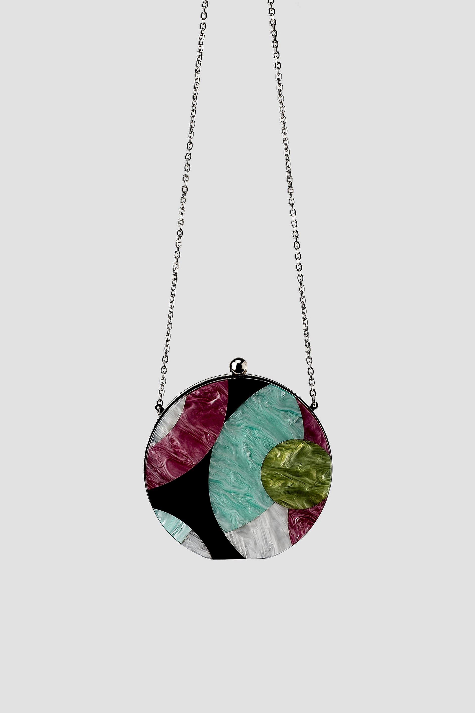 A colorful box bag on a chain