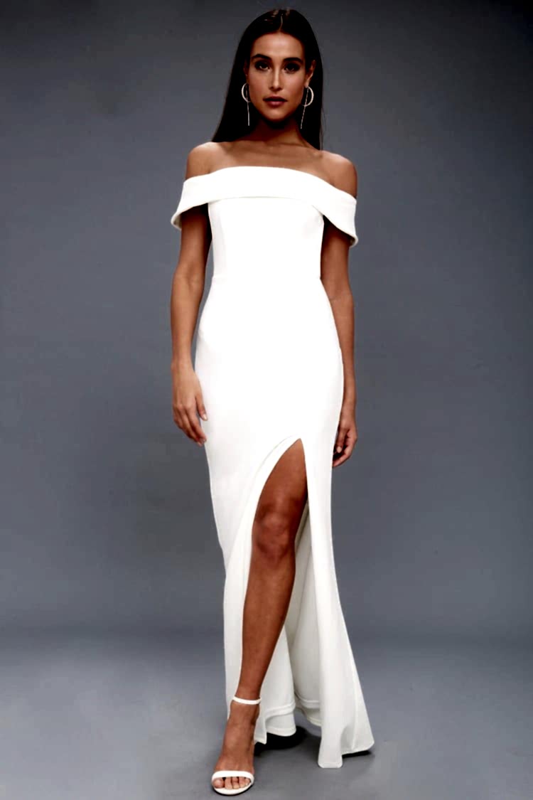 woman wearing an off the shoulder wedding dress with a thigh slit