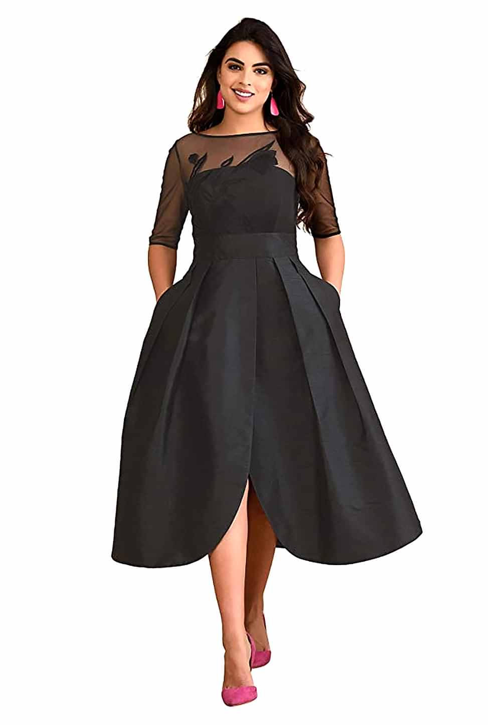 A model wears a Back zip with hook-and-eye closure, Boat neck, Sheer tulle elbow length sleeves, inner shoulder bra strap keeps, and a Princess seamed bodice.