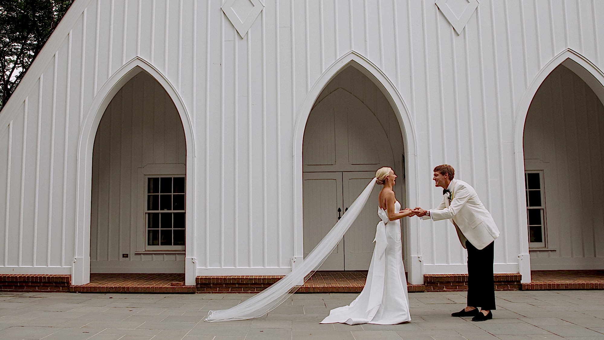 A man and woman greet each other on their wedding day.
