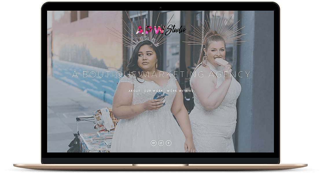 Laptop screen open to APW Studio Homepage