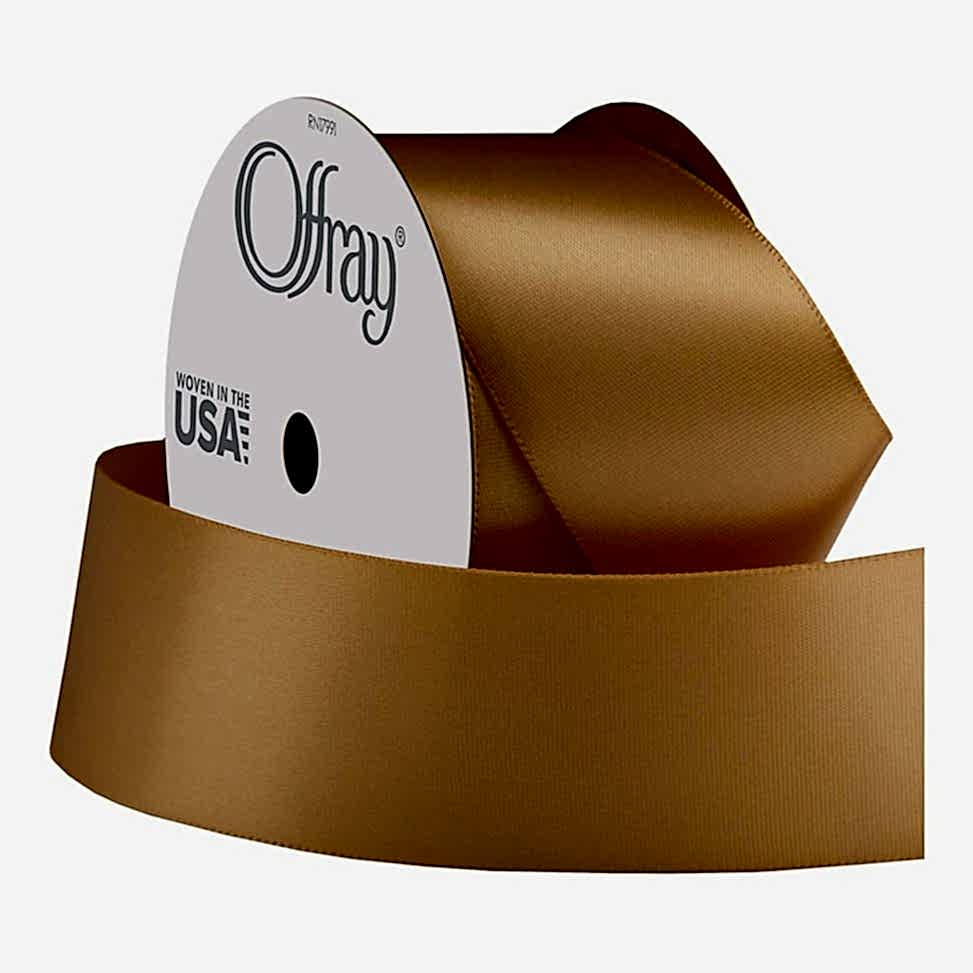 A roll of gold satin ribbon.