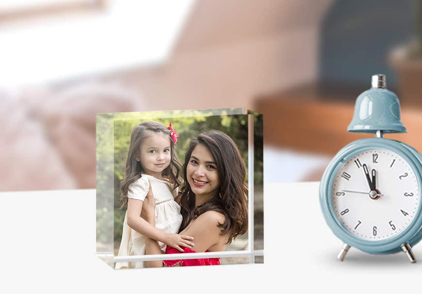 A photo block of a woman hold a child.