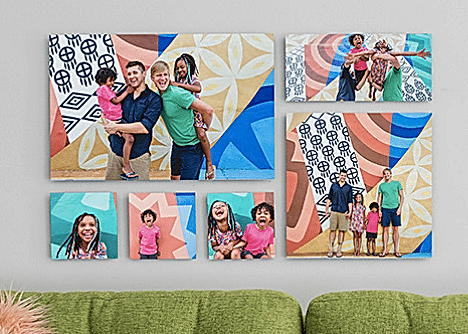 A wall with a collage of printed photos.
