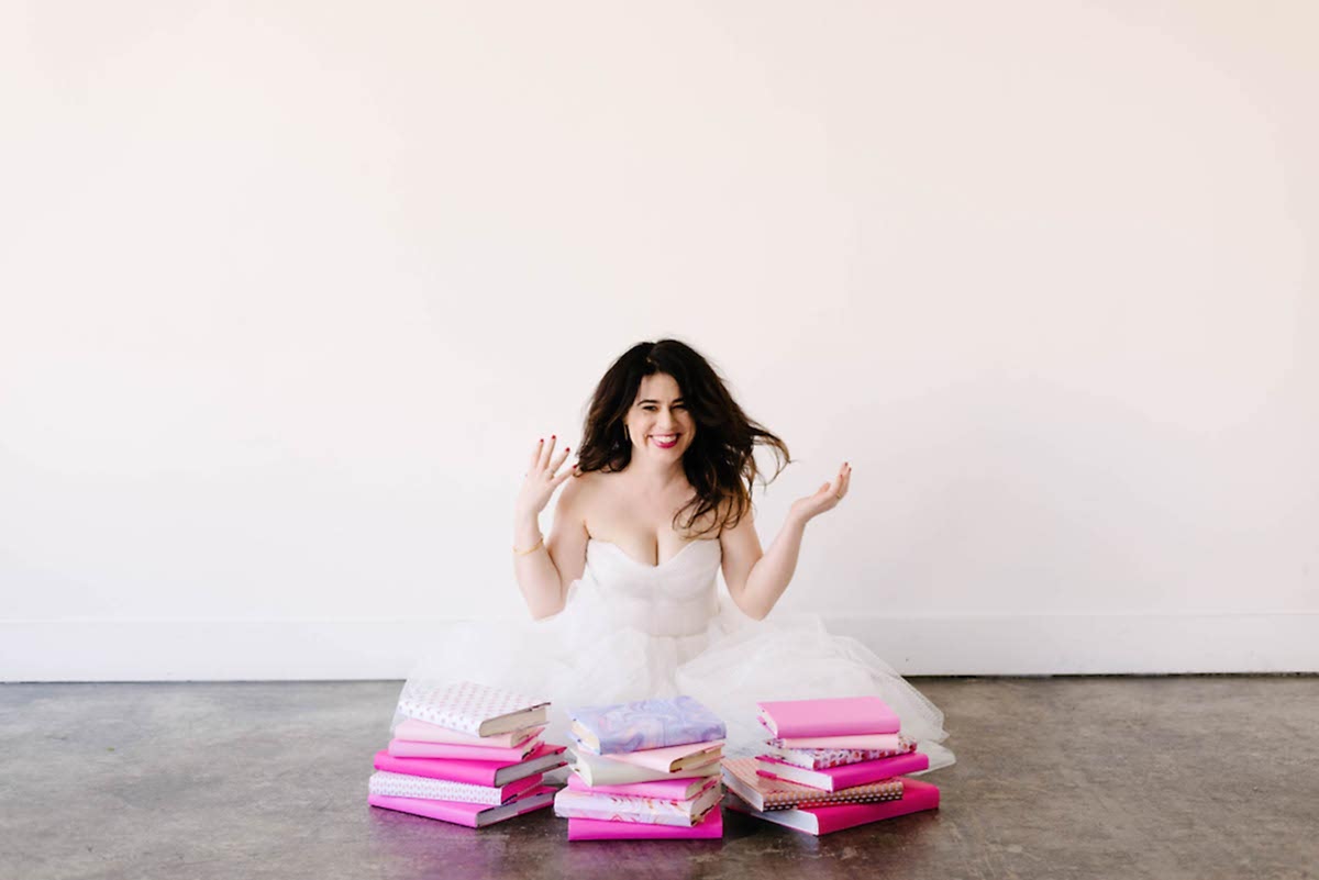 Meg with some pink books.