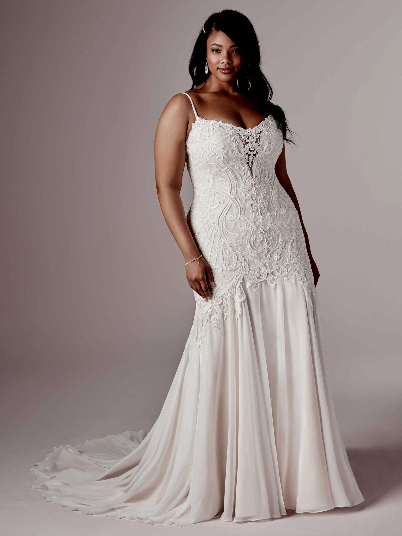 A woman wears the Corrine dress by Maggie Sottero