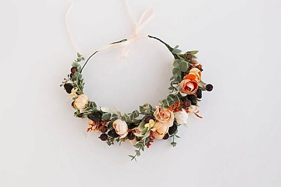 A burnt orange flower headpiece