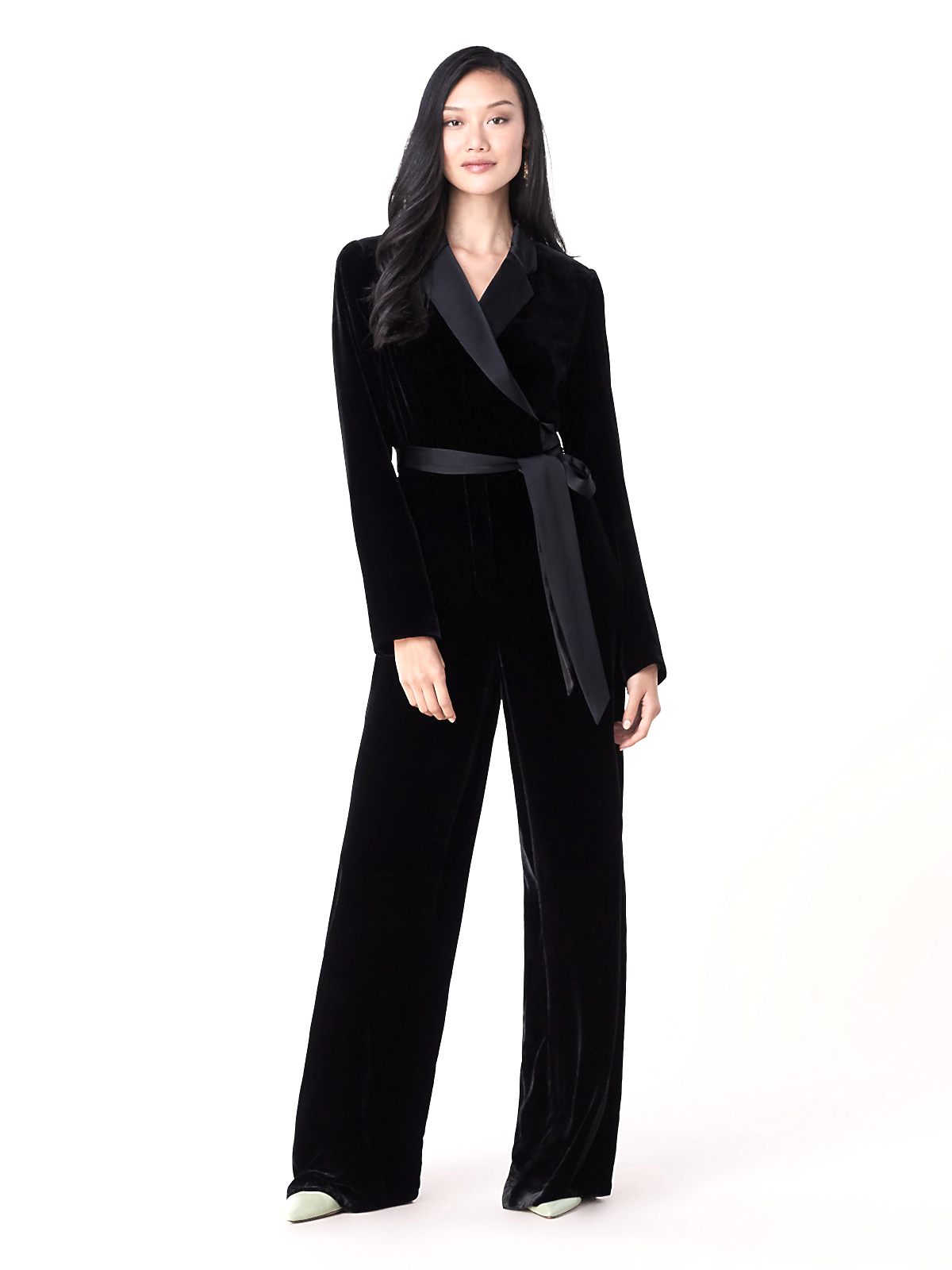 This velvet wedding jumpsuit has a wrap top adorned with a notched lapel and falls into a flattering wide-leg pant.