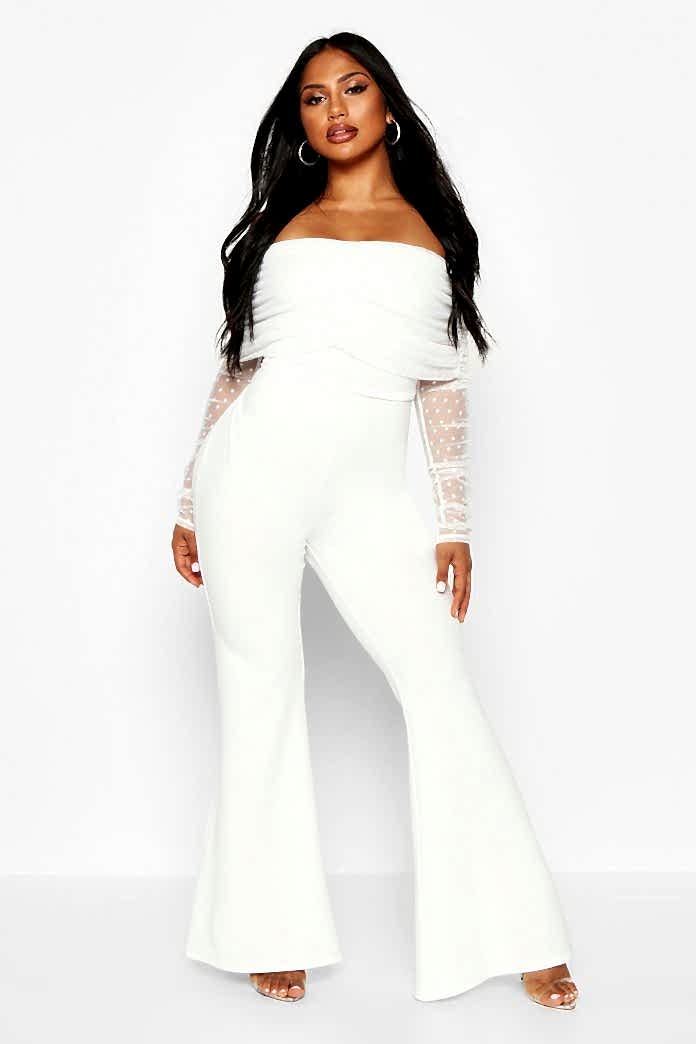 Flared legs with meshed sleeves and this jumpsuit WORKS.