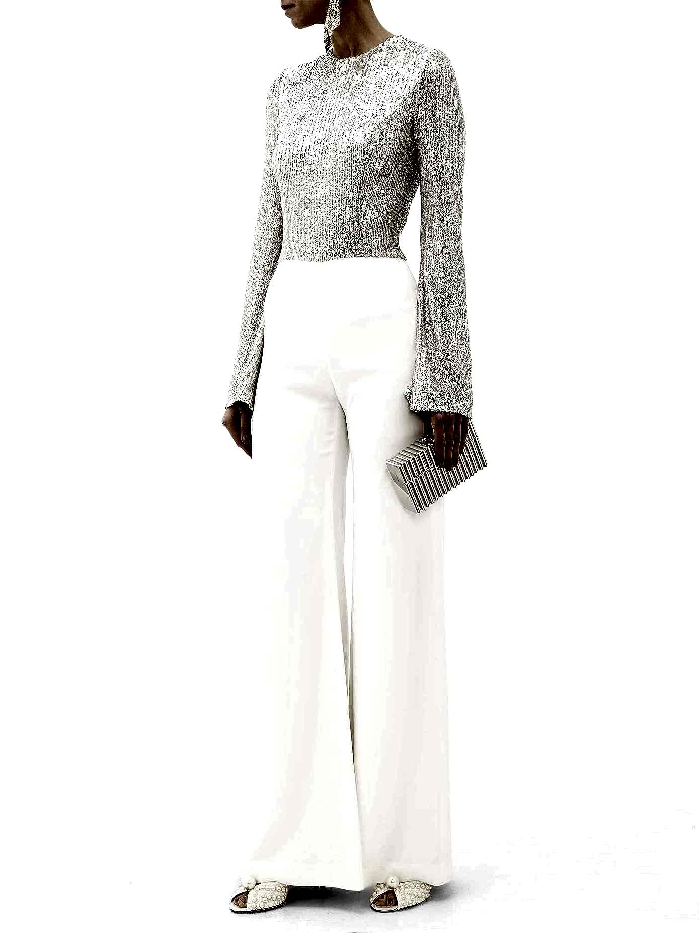 Crafted in Italy to a demure high neckline and gently flared sleeves, descending to pristine white wide-leg crepe trousers.