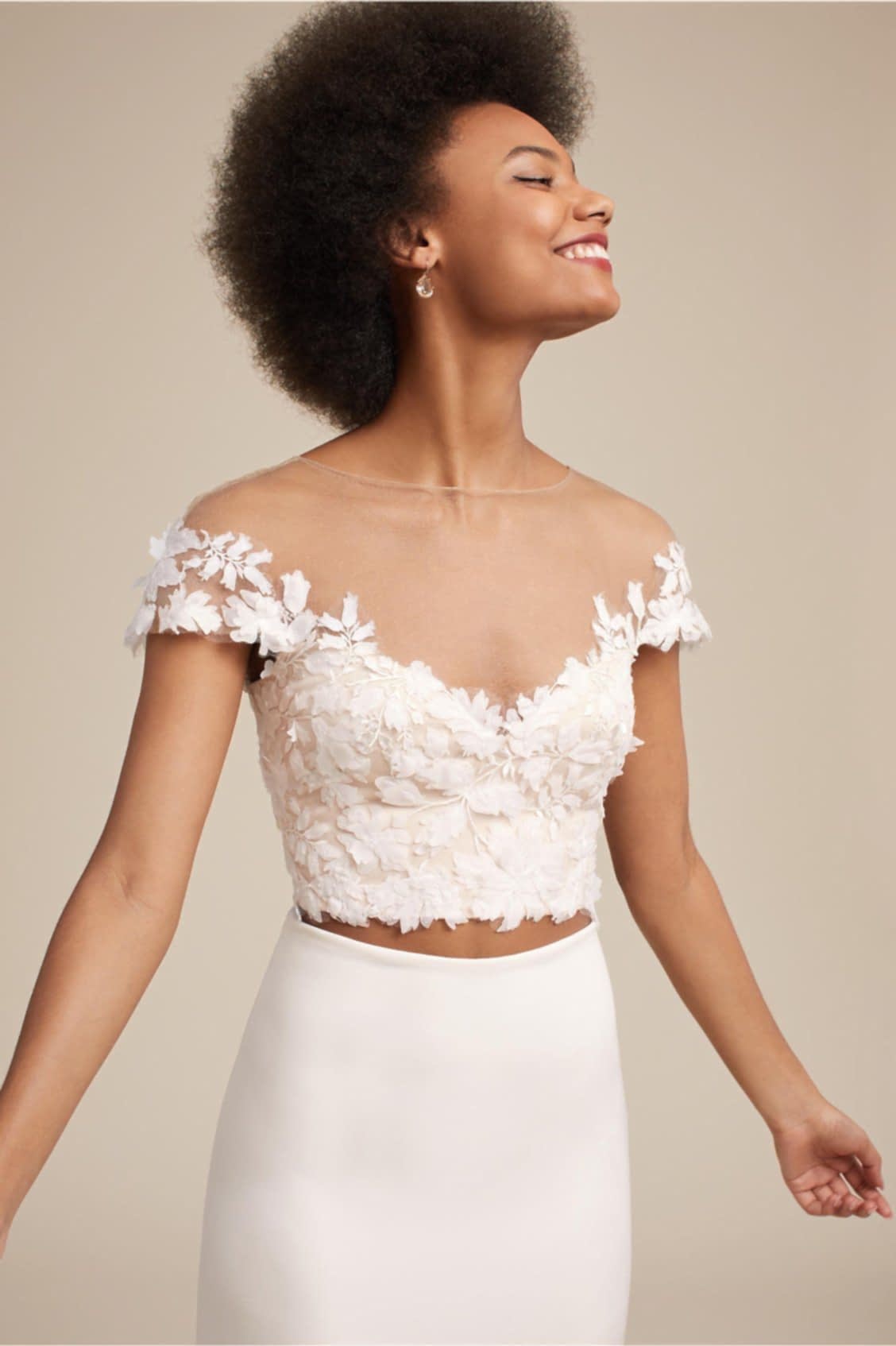 Fluttering top on a wedding separates outfit.