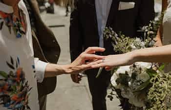 Mother ins law touching bride's ring