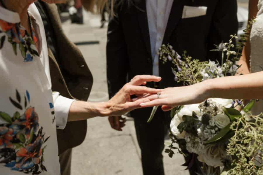 Mother ins law touching bride's ring